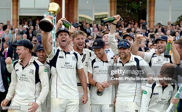 James Franklin of Middlesex holds the trophy after his team won the county championship title on day four of the Specsavers County Championship...