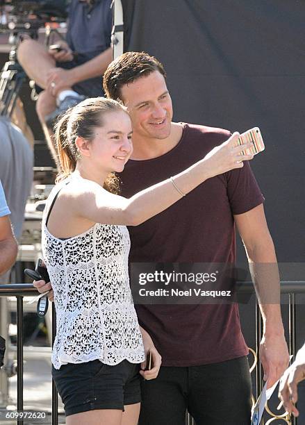 Ryan Lochte takes a selfie with a fan at "Extra" at Universal Studios Hollywood on September 23, 2016 in Universal City, California.