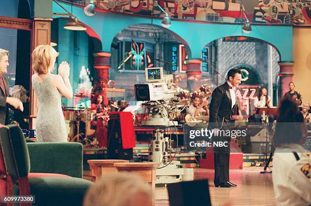 Episode 1141 -- Pictured: Host Jay Leno and actress Sharon Lawrence clap for magician Lance Burton on May 5, 1997 --