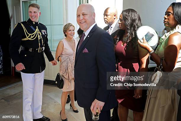 New Orleans Mayor Mitch Landrieu walks back into the Green Room during a reception in honor of the opening of the Smithsonian National Museum of...