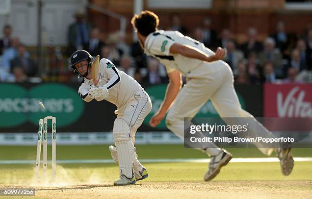 Steven Finn of Middlesex bowls Steven Patterson during day four of the Specsavers County Championship Division One cricket match between Middlesex...