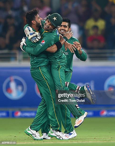 Sarfraz Ahmed and Imad Wasim celebrates the wicket of Carlos Brathwaite of West Indies during the first T20 International match between Pakistan and...