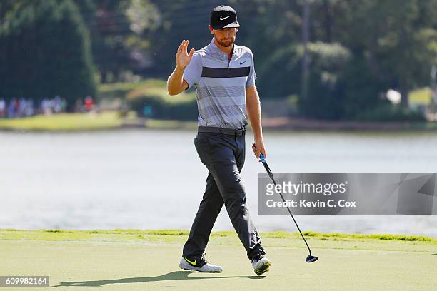 Kevin Chappell waves to the gallery after a birdie on the eighth hole during the second round of the TOUR Championship at East Lake Golf Club on...