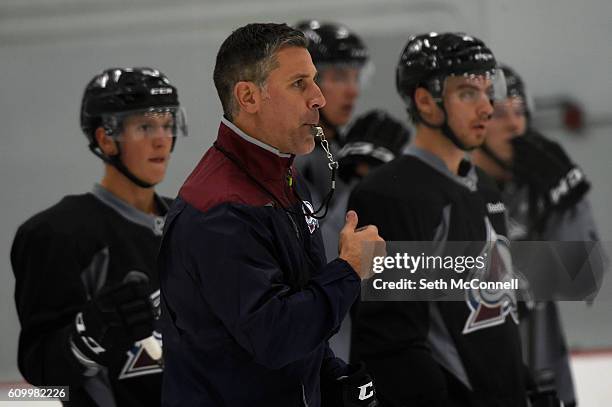 Avalanche coach Jared Bednar blows a whistle as he watches his team run through a skating drill during the first day of training camp at Family...