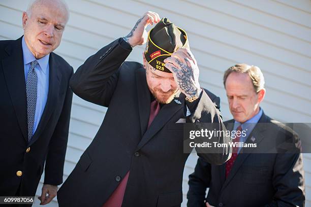 Sens. Pat Toomey, R-Pa., right, and Sen. John McCain, R-Ariz., left, prepare for a photo with Post Commander John Sheaffer, during a campaign at the...