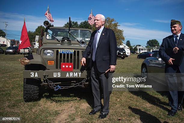 Sen. John McCain, R-Ariz., poses with a military-style Jeep during a campaign event for Sen. Pat Toomey, R-Pa., at the Herbert W. Best VFW Post 928...