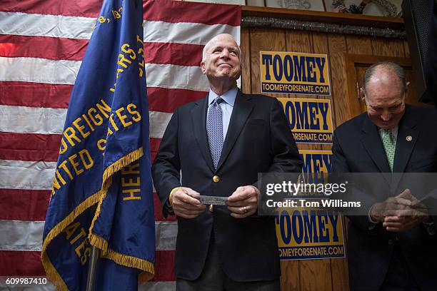 Sen. John McCain, R-Ariz., attends a campaign event for Sen. Pat Toomey, R-Pa., off camera, at the Herbert W. Best VFW Post 928 in Folsom, Pa.,...