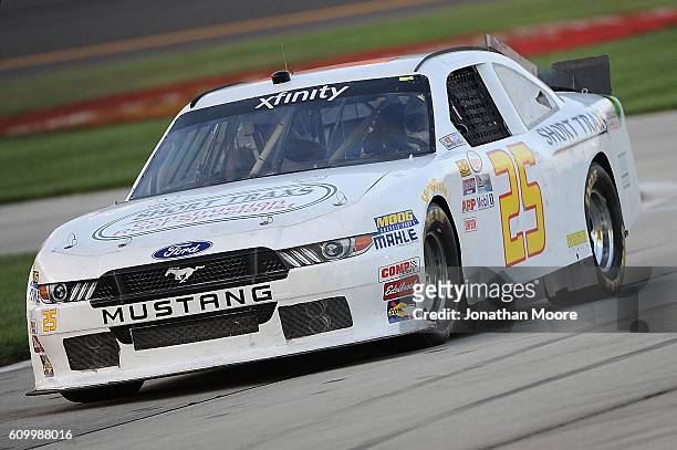 Chris Cockrum, driver of the Advanced Communications Systems Chevrolet, drives into the garage during practice for the NASCAR XFINITY Series...