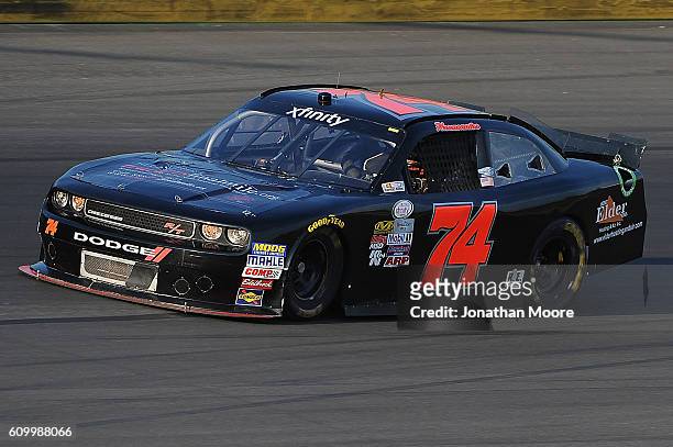 Mike Harmon, driver of the Dodge, on track during practice for the NASCAR XFINITY Series VysitMyrtleBeach.com 300 at Kentucky Speedway on September...