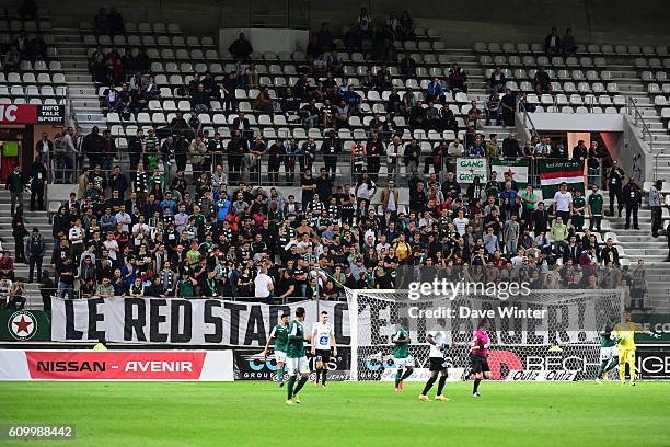 Red Star fans hold up a banner demanding a return to their historic Stade Bauer during the French Ligue 2 match between Red Star FC and Chamois...