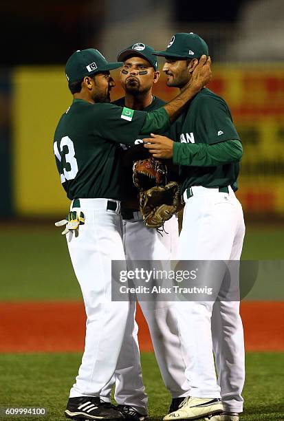 Muhammad Zohaib, Faquir Hussain and Arshad Khan of Team Pakistan celebrate getting the last out of the first inning during Game 4 of the 2016 World...