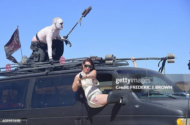 Festival goers attend day two of Wasteland Weekend in the high desert community of California City in the Mojave Desert, California, on September 23,...