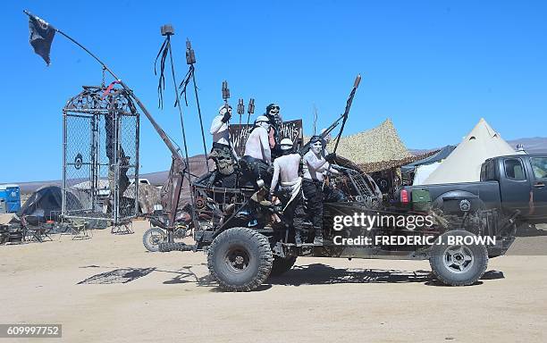 Festival goers attend day two of Wasteland Weekend in the high desert community of California City in the Mojave Desert, California, on September 23,...