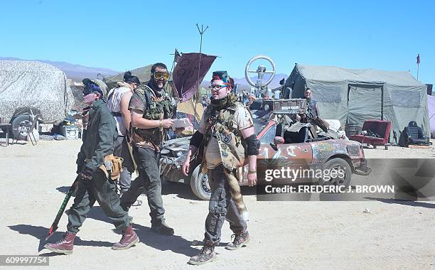 Festival goers attend day two of Wasteland Weekend in the high desert community of California City in the Mojave Desert, California, on September 23,...