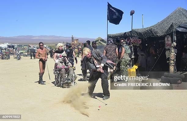 Festival goers attend day two of Wasteland Weekend in the high desert community of California City in the Mojave Desert, California, on September 23,...