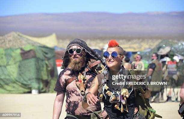 Festival goers attend day two of Wasteland Weekend in the high desert community of California City in the Mojave Desert, California, on September 23,...