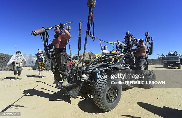 Festival goers attend day two of Wasteland Weekend in the high desert community of California City in the Mojave Desert, California, on September 23,...