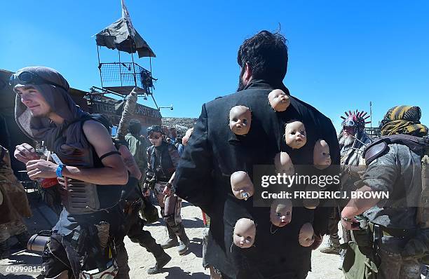 Festival goers attend day two of Wasteland Weekend in the high desert community of California City in the Mojave Desert, California, on September 23,...