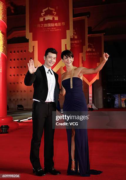 Actor Huang Xiaoming and actress Sophie Marceau arrive at the red carpet of the closing ceremony of the 3rd Silk Road International Film Festival at...