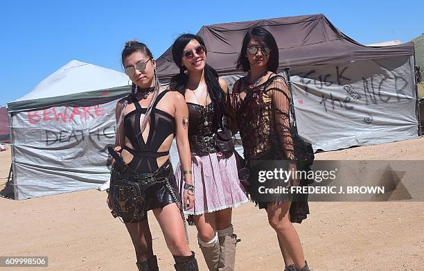 Festival goers Lena Liew, Debbie Chen and Jae Lam attend day two of Wasteland Weekend in the high desert community of California City in the Mojave...