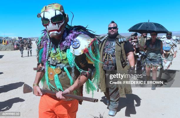 Festival goers attend day two of Wasteland Weekend in the high desert community of California City in the Mojave Desert, California, on September 23,...