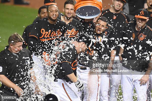 Mark Trumbo of the Baltimore Orioles celebrates a walk off home run in the 12th inning during a baseball game against the against the Arizona...