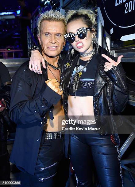 Recording artists Billy Idol and Miley Cyrus pose backstage at the 2016 iHeartRadio Music Festival at T-Mobile Arena on September 23, 2016 in Las...