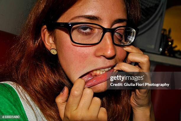 young woman pulling a face - ugly mexican people stock pictures, royalty-free photos & images