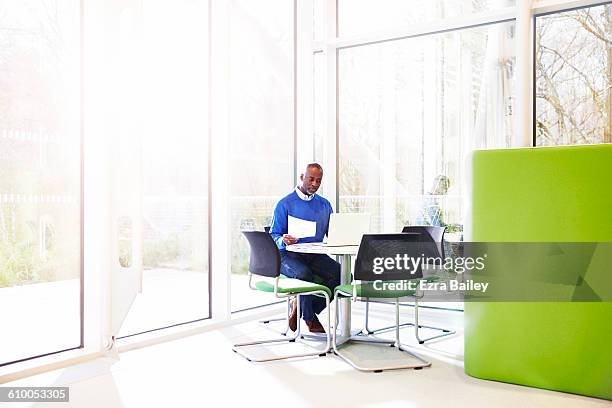 businessman working in sustainable office - gray green stock pictures, royalty-free photos & images