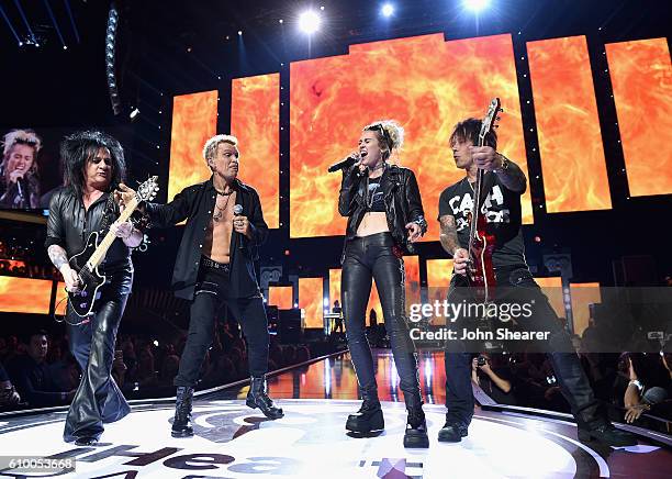 Recording artists Steve Stevens, Billy Idol, Miley Cyrus, and Billy Morrison perform onstage at the 2016 iHeartRadio Music Festival at T-Mobile Arena...