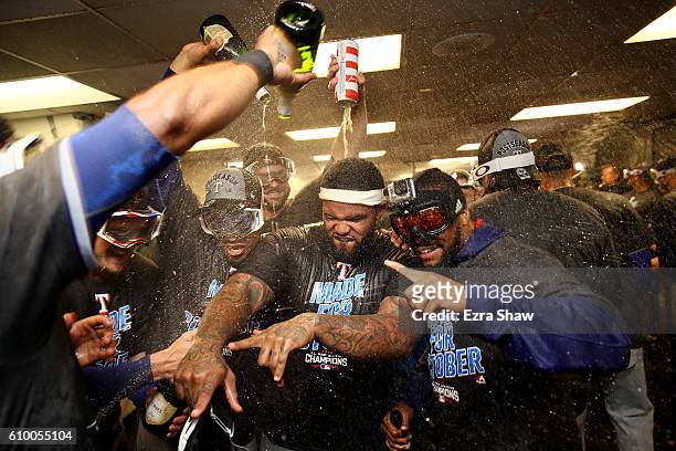 The Texas Rangers, including Prince Fielder in the center, celebrate in the lockerroom after they clinched the American League West Division Tital at...