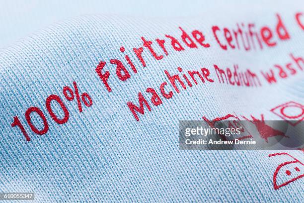 fair trade printed on cotton fabric - fair trade stock-fotos und bilder