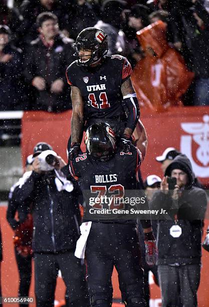 Raelon Singleton and Garett Bolles of the Utah Utes celebrate Singleton's fourth quarter touchdown against the USC Trojans at Rice-Eccles Stadium on...