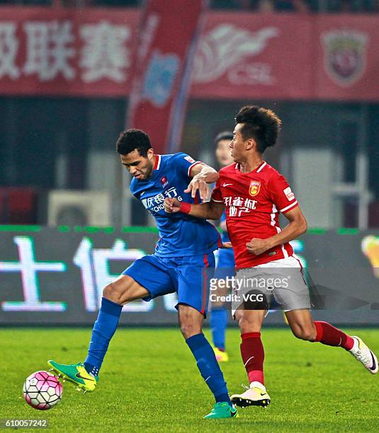 Alan Kardec of Chongqing Lifan competes for the ball during the 26th round match of CSL Chinese Football Association Super League on September 26,...