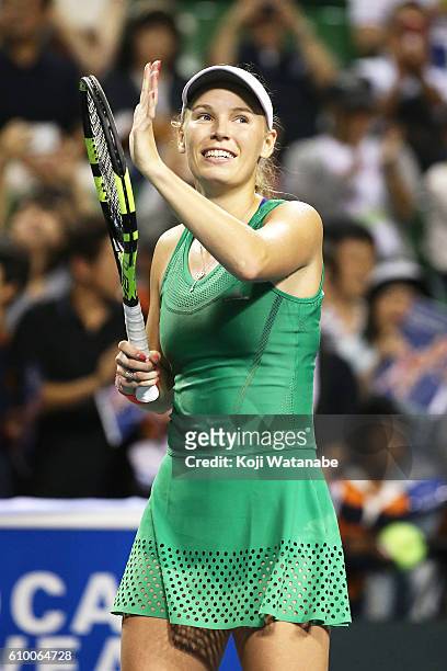 Caroline Wozniacki of Denmark celebrates the winner Agnieszka Radwanska of Poland during women's singles semifinal match day 6 of the Toray Pan...