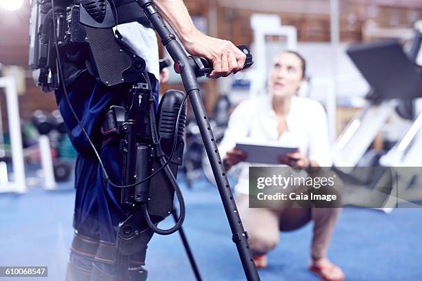 Equipment attached to man receiving physical therapy