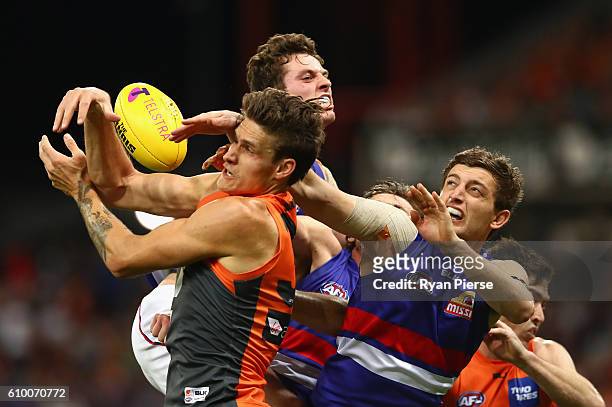 Rory Lobb of the Giants competes for the ball against Fletcher Roberts of the Bulldogs during the AFL First Preliminary Final match between the...