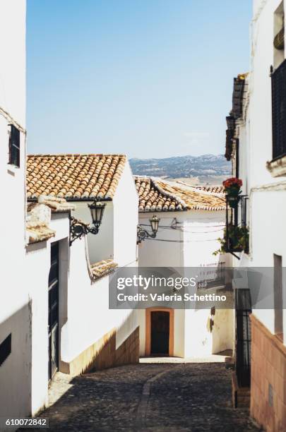 narrow street, ronda, andalucia, spain - luogo d'interesse stock pictures, royalty-free photos & images