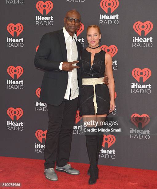 Former professional football player Eric Dickerson and Penny Sutton attend the 2016 iHeartRadio Music Festival at T-Mobile Arena on September 23,...