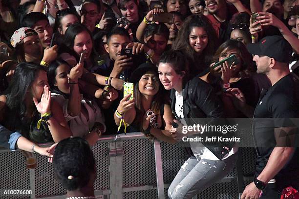 Recording artist Tegan Rain Quin of Tegan and Sara poses for a photo with a festival goer during day 1 of the 2016 Life Is Beautiful festival on...