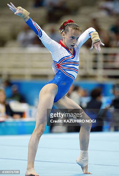 Emilie Le Pennec of France performs on the floor in the women's Artistic Gymnastics qualifications, 15 August 2004 at the Olympic Indoor Hall during...