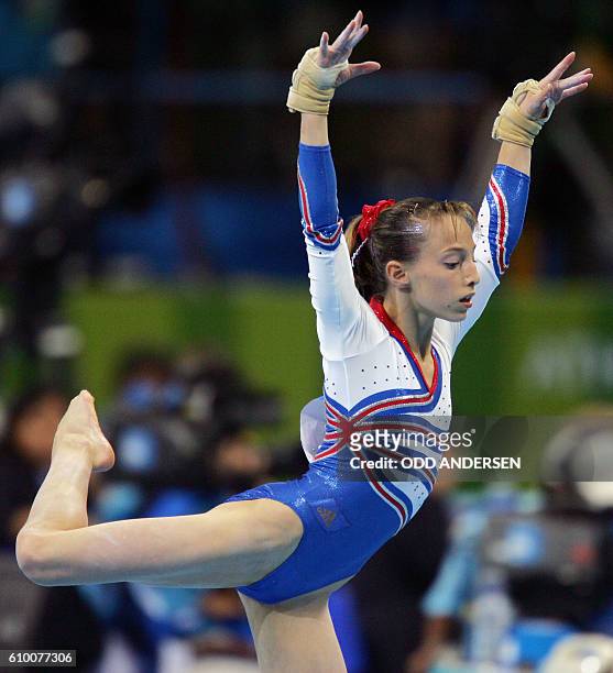 Emilie Le Pennec of France performs on the floor 17 August 2004 at the Olympic Indoor Hall during the women's artistic gymnastics team final of the...