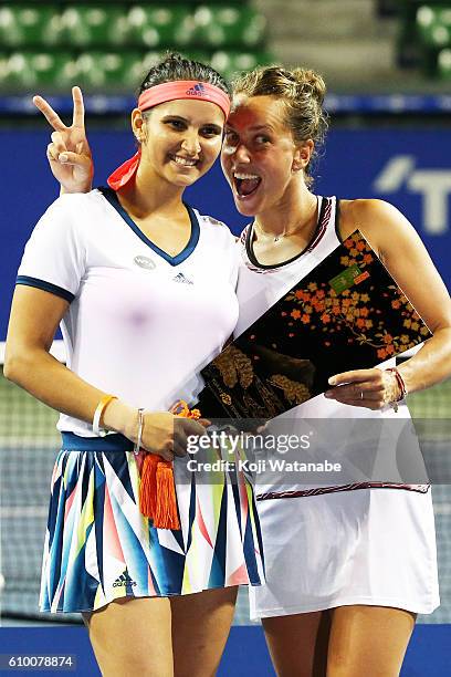 Sania Mirza of India and Barbora Strycova of Czech Republic celebrate the winner during women's Doubles Final match day 6 of the Toray Pan Pacific...