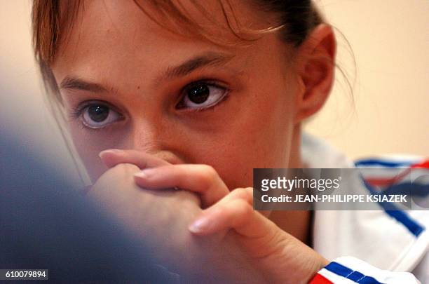 French Emilie Le Pennec offers a press conference on August 23, 2004 in Athens,a day after winning the gold medal in the women's artistic gymnastics...