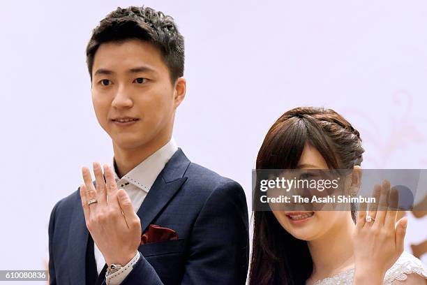 Table tennis players Ai Fukuhara and Chiang Hung-Chieh pose for photographs during a press conference announcing their marriage on September 22, 2016...