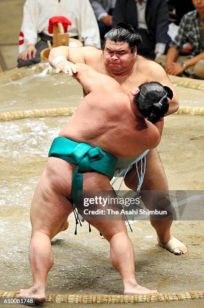 Sekiwake Takayasu pushes Yoshikaze out of the ring to win during day twelve of the Grand Sumo Autumn Tournament at Ryogoku Kokugikan on September 22,...