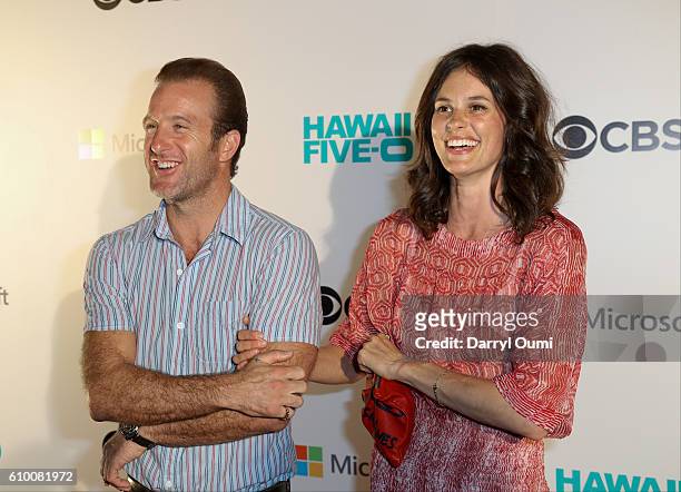 Actor Scott Caan and Kacy Byxbee speak with the media as they arrive at the CBS 'Hawaii Five-0' Sunset On The Beach Season 7 Premier Event at Queen's...