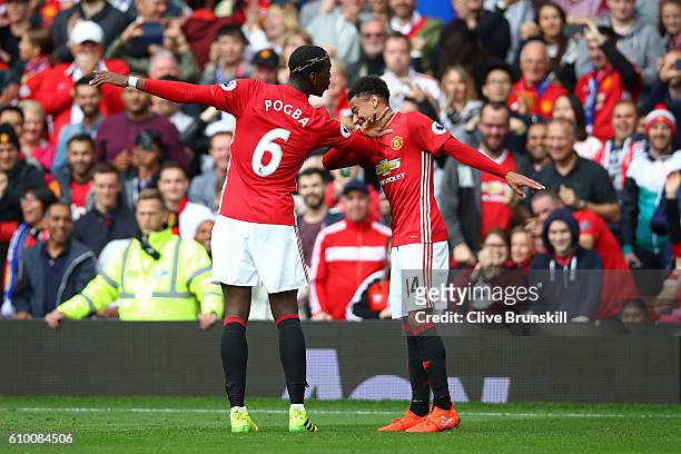 Paul Pogba of Manchester United celebrates scoring his sides fourth goal with Jesse Lingard of Manchester United during the Premier League match...