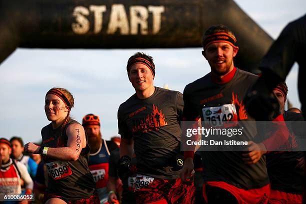 Participants start the 2016 Tough Mudder - London South at Holmbush Farm on September 24, 2016 in Horsham, England.