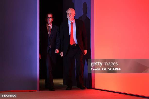 British opposition Labour Party leader Jeremy Corbyn, , and Labour leadership contender MP Owen Smith, arrive on stage ahead of the party's...